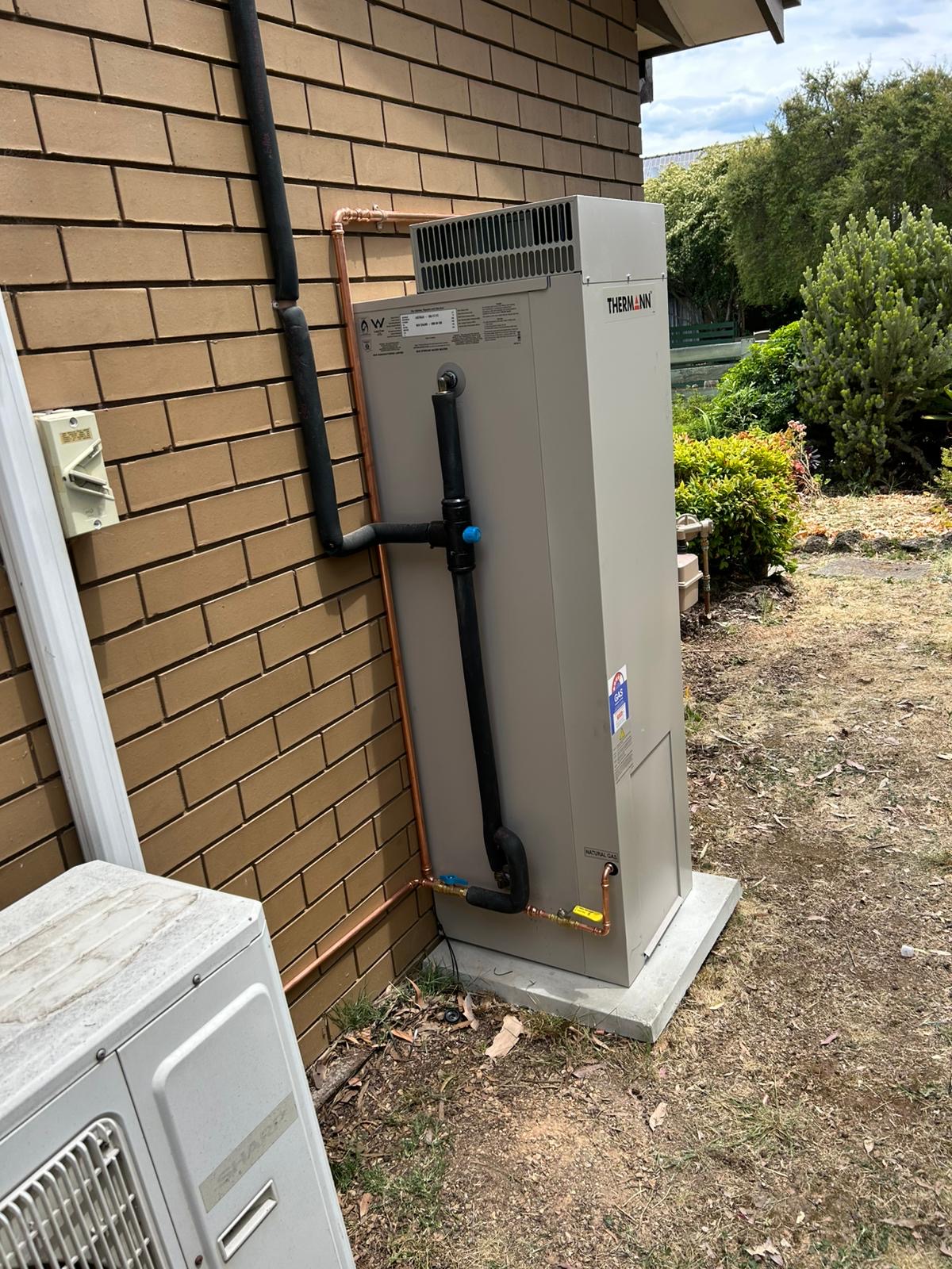 Thermann storage hot water system installed externally at Greensborough home Melbourne